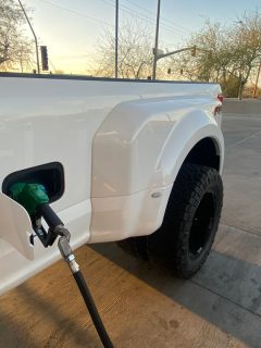 A long bed Dually Chevy truck gassing up, How To Rotate Tires On A Dually