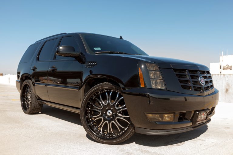 A photo of a black parked Cadillac Escalade, the Escalade from Cadillac is their most popular SUV. - How Much Does A Lincoln Navigator Weigh?