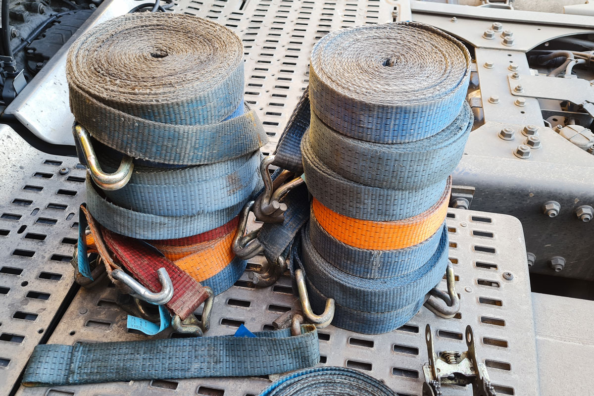 A stack of tie downs for a camper