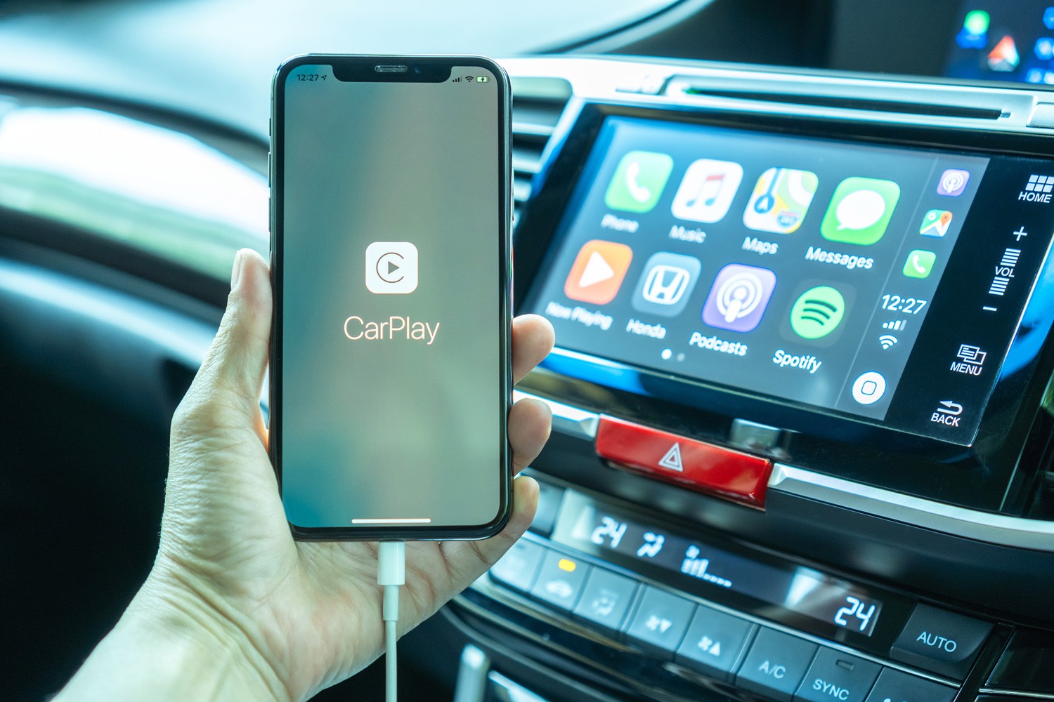 Apple CarPlay app on iPhone X, smart mobile application connected to Honda car for travel map, hand free phone call, online music on transportation vehicle safety