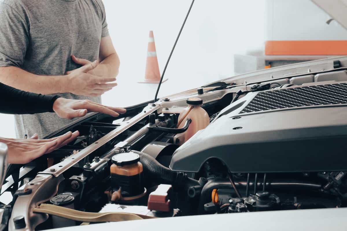 Automotive mechanic helps to check car engine, battery, radiator heating, motor oil, and fuel for travel with no problem. Garage shop technician repair vehicles and fix damage or failure parts.
