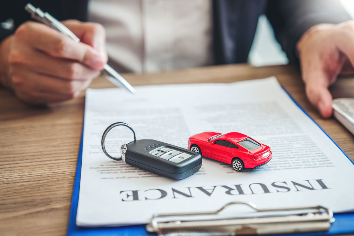 Auto insurance agent signing a contract