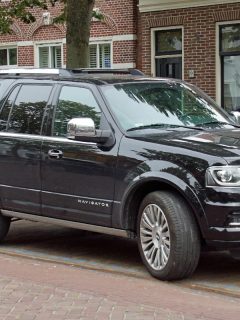 A black Lincoln Navigator parked by the side of the road, How Big Is The Gas Tank On A Lincoln Navigator?