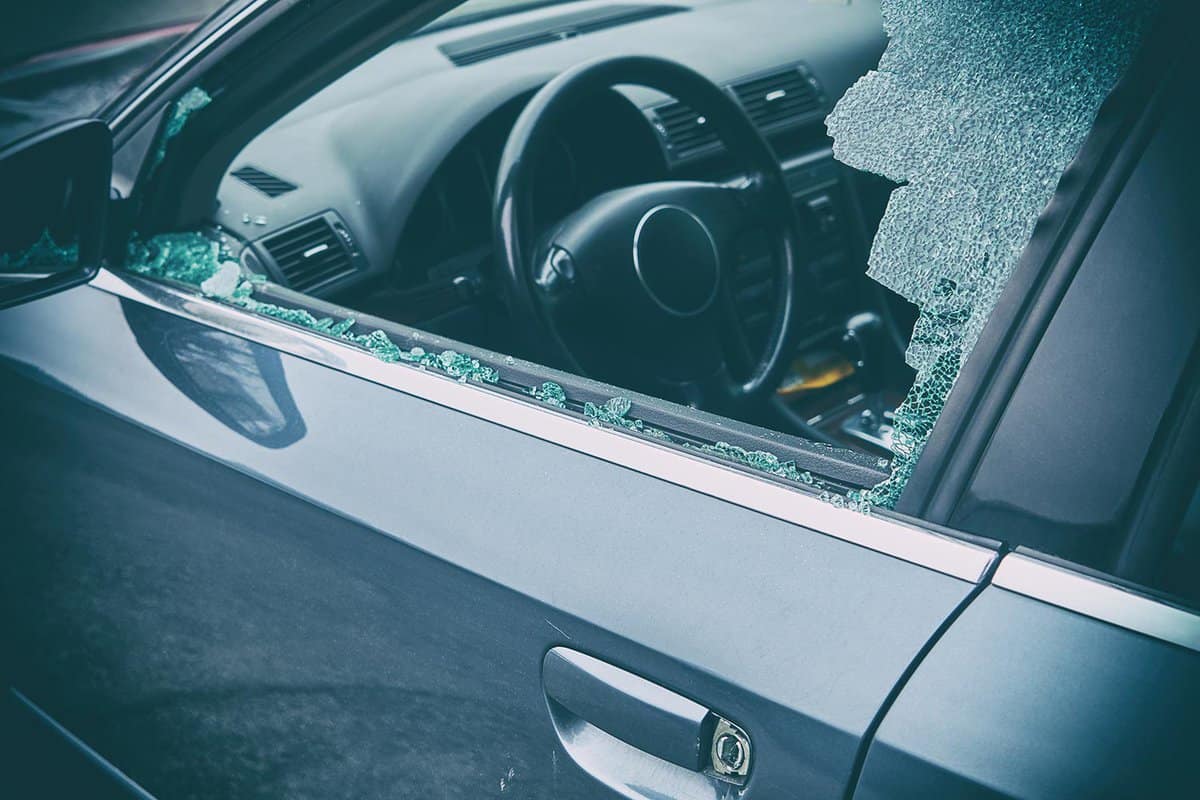 Broken left side window of a car