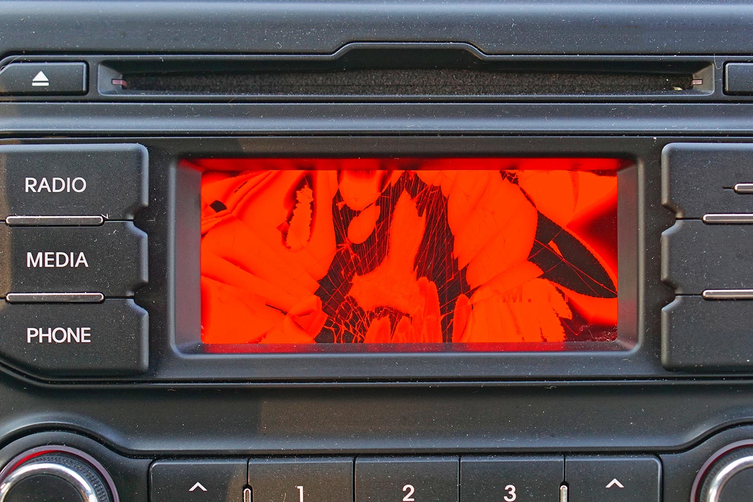 Broken red liquid crystal display in car dash board