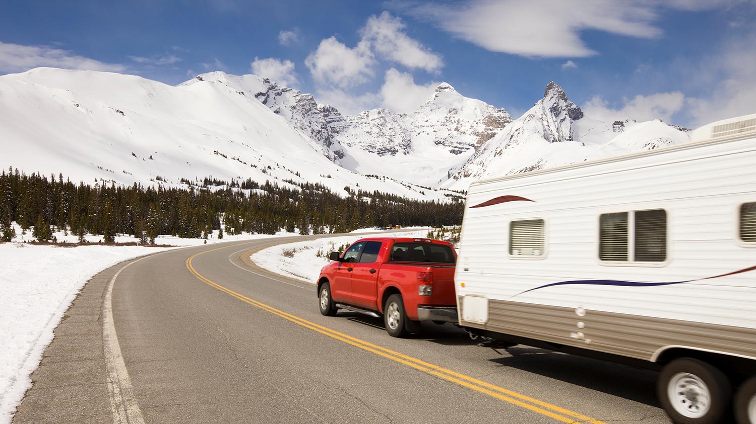 Car and travel trailer in the mountains