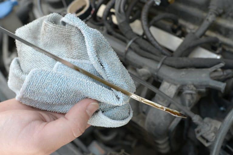 A car mechanic check oil level, Condensation in Engine Oil — What To Do?