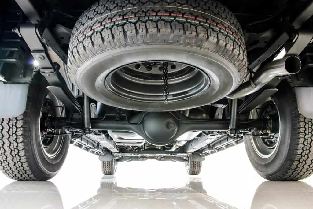 Car spare tire and rear axle suspension