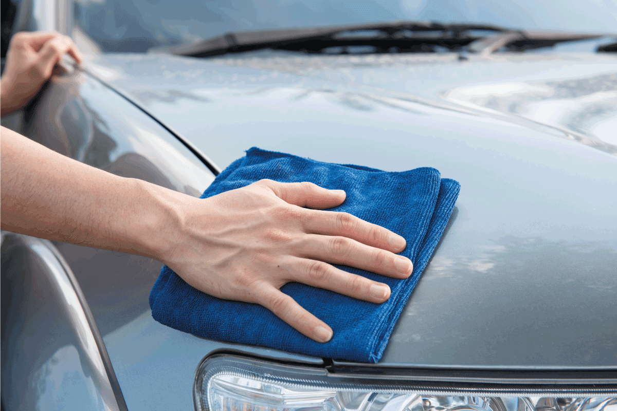 Cleaning the car with microfiber cloth and wax coating. How To Get Bugs Off Car With Dryer Sheets