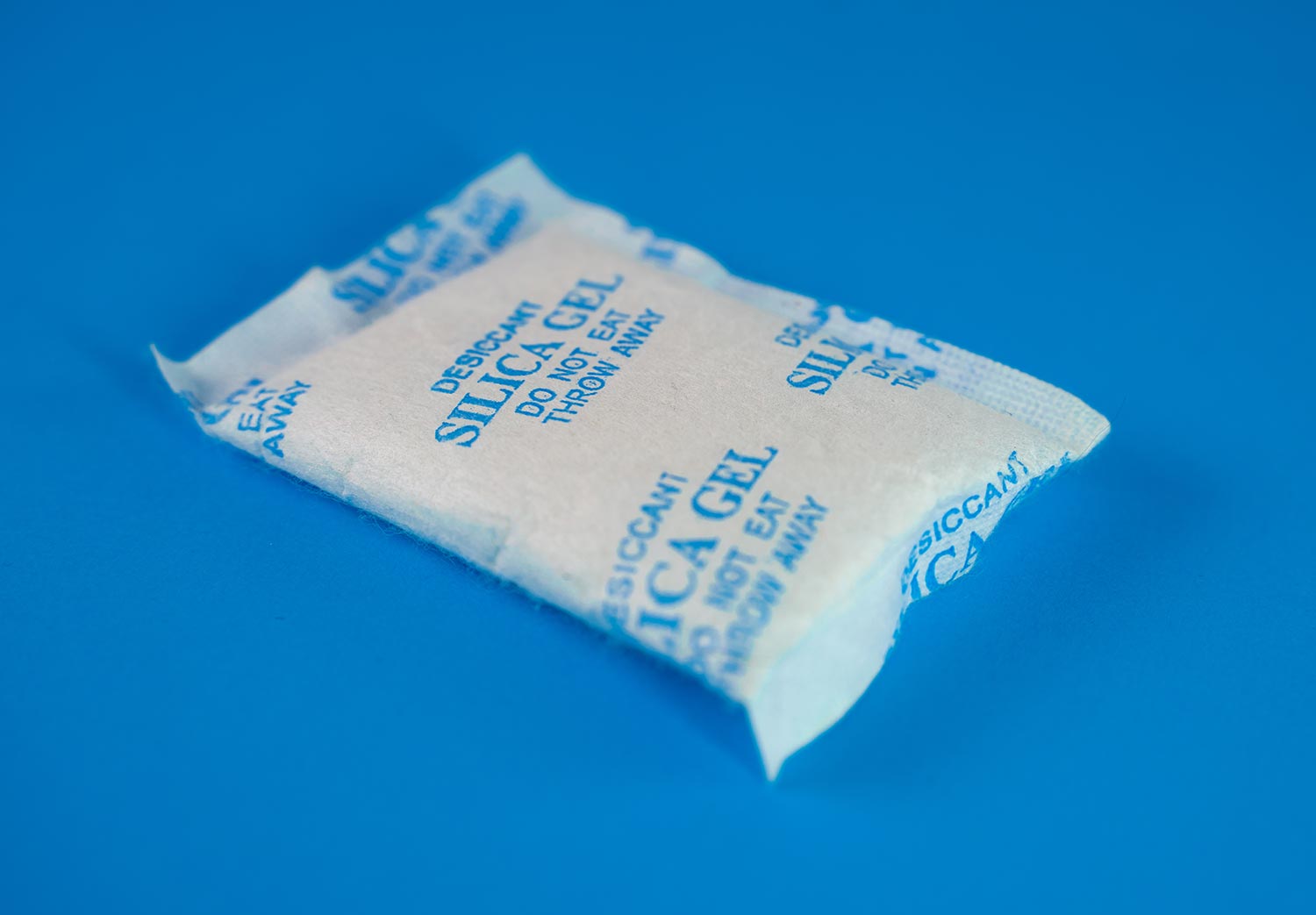 Desiccant or silica gel in white paper packaging