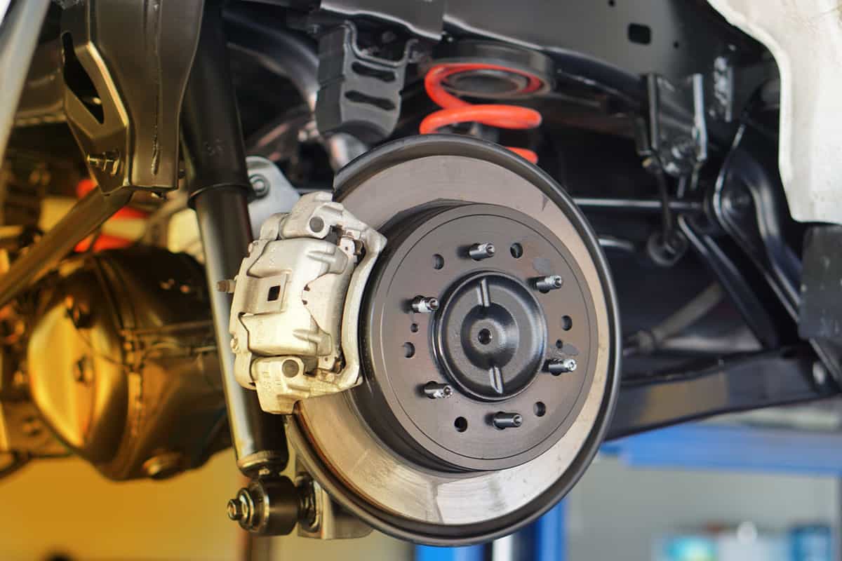 Disc brake of the vehicle for repair, in process of new tire replacement