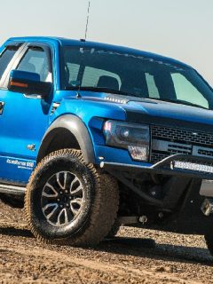 A Ford F150 Raptor SUV is on the road driving on dirt, Do Ford F150 Have Torsion Bars?