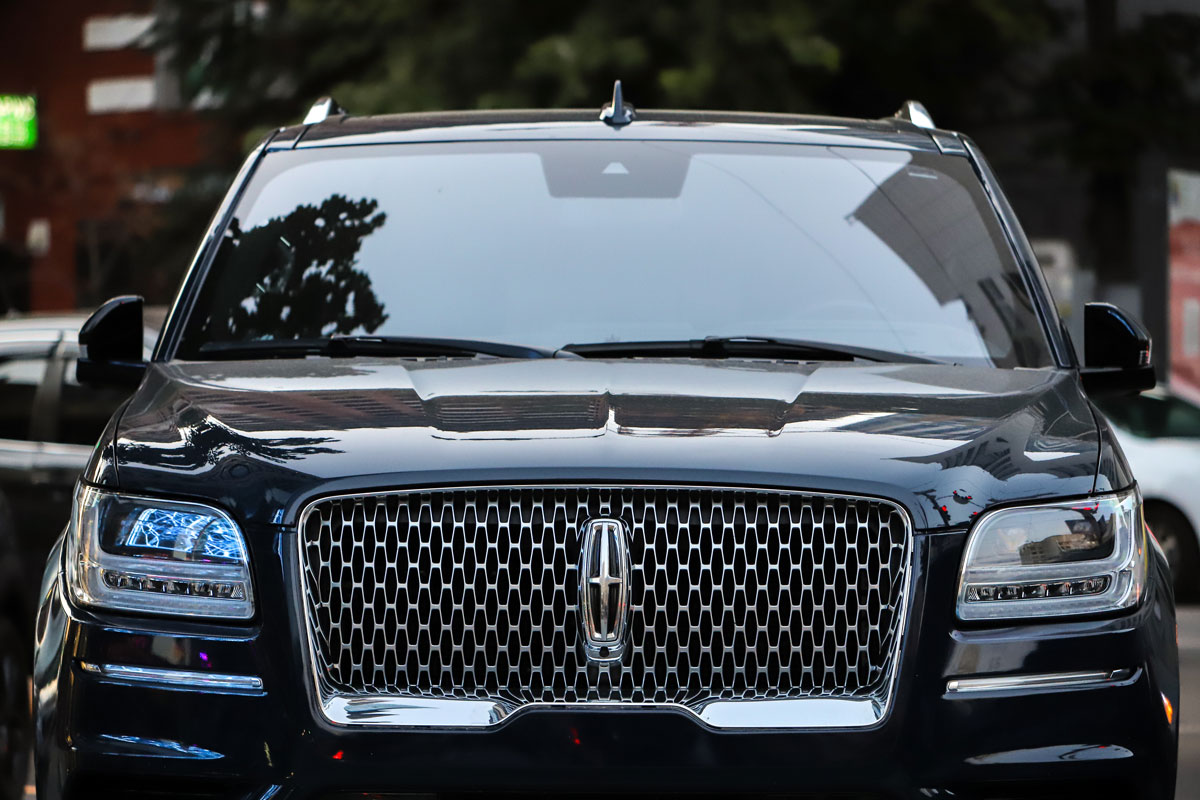 Front view of a black luxury SUV car Lincoln Navigator