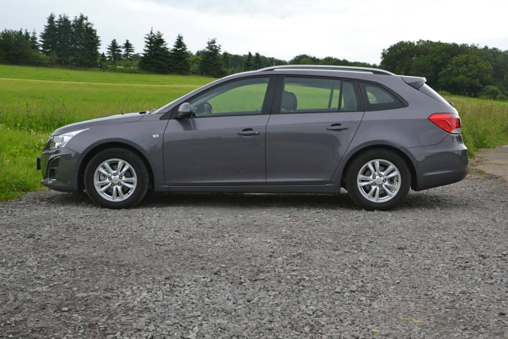 Gray Chevrolet Cruze SW (combi version) stopped on the road.
