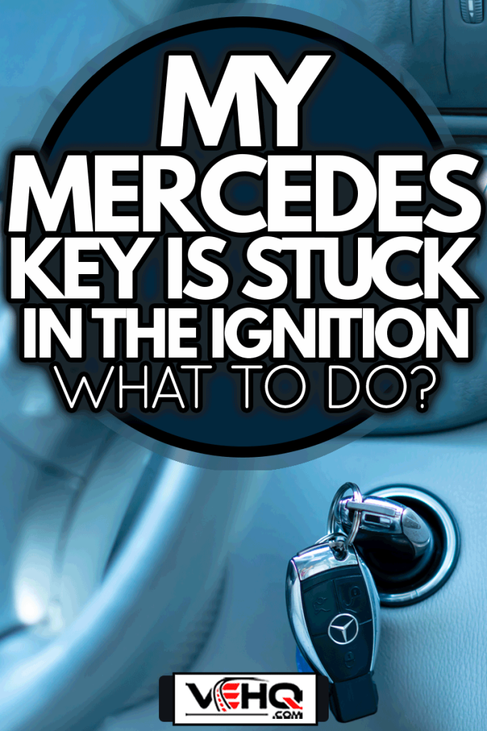 Two chrome-plated ignition keys, locked on a key ring, inside a Mercedes Benz C Class engine ignition switch, My Mercedes Key Is Stuck In The Ignition - What To Do?