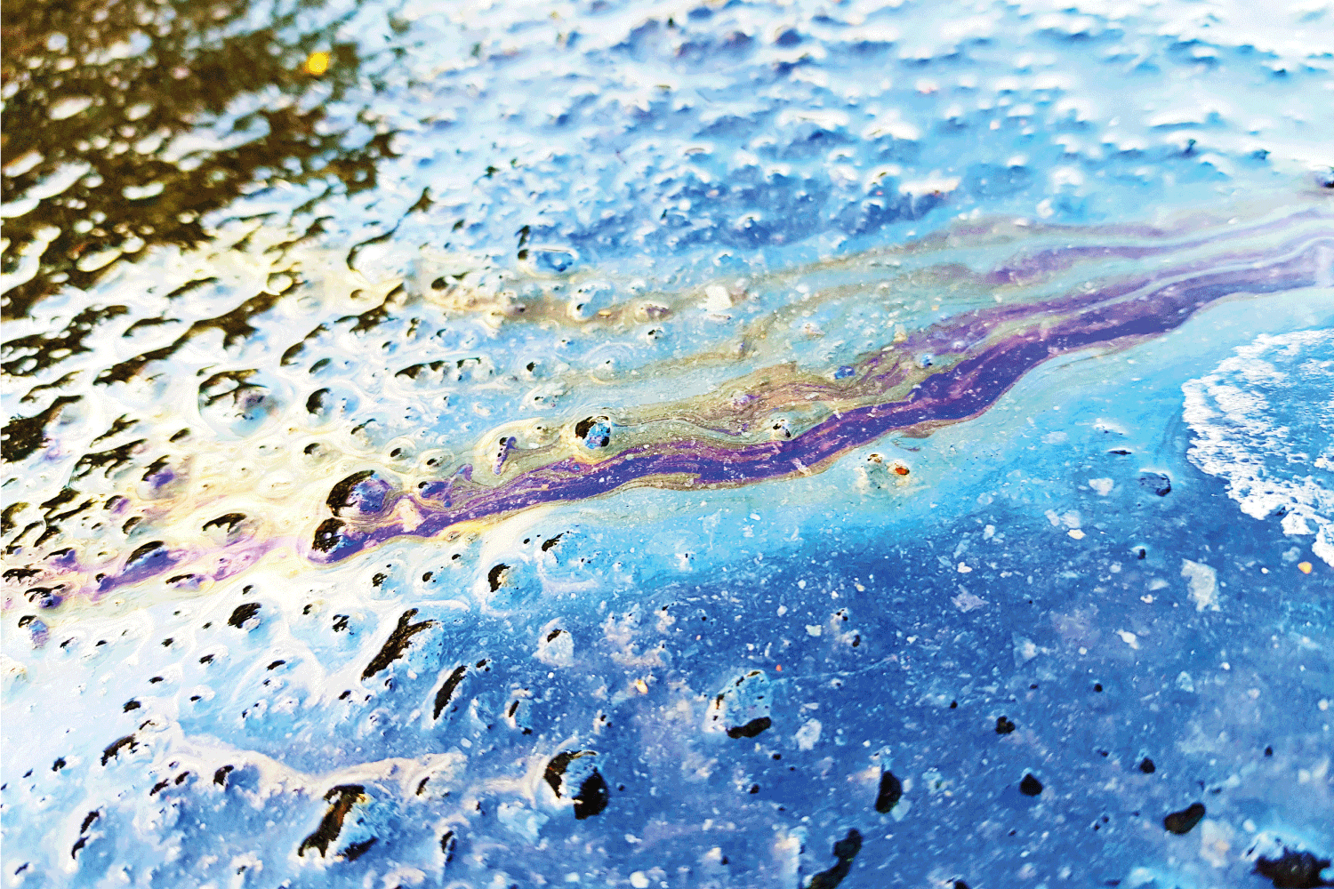 Oil on a rainy street produces a colorful spectrum.