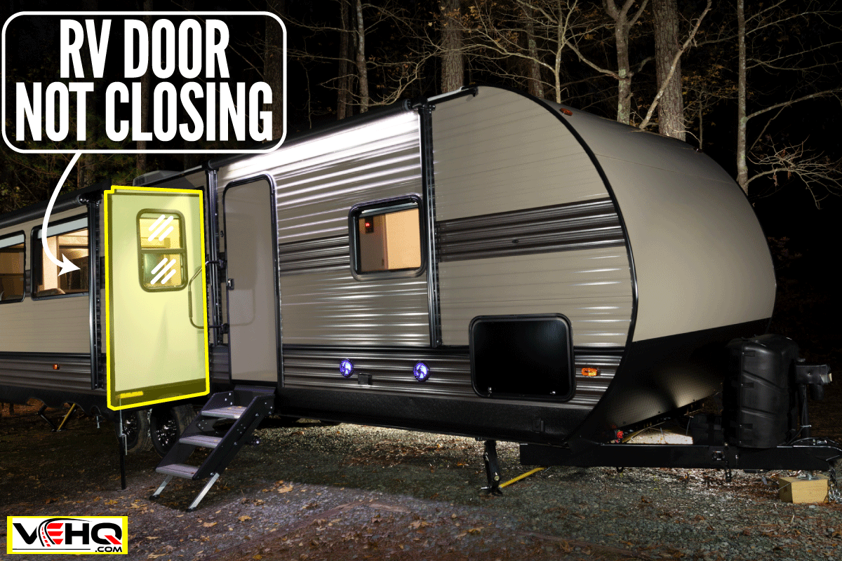 Camping trailer lighted at night with doors open, RV Door Not Closing - What To Do?