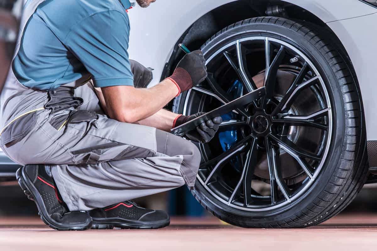 Tires and Wheels Inspection by Professional Automotive Technician in the Certified Auto Service
