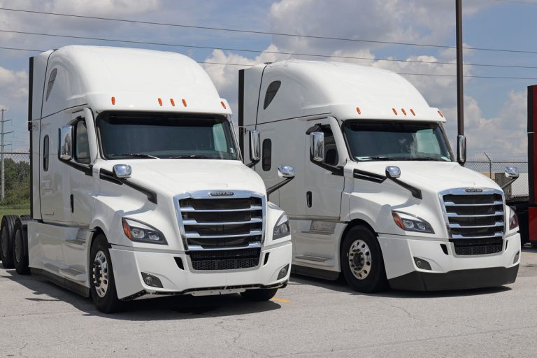 Two freightliner trucks parked at a dealership, What Is The Life Expectancy Of A DD15 Engine?