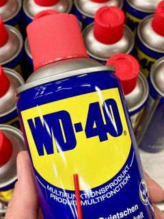 WD-40 lubricant products displayed on a store, Can You Use Wd40 To Remove Spray Paint From A Car?