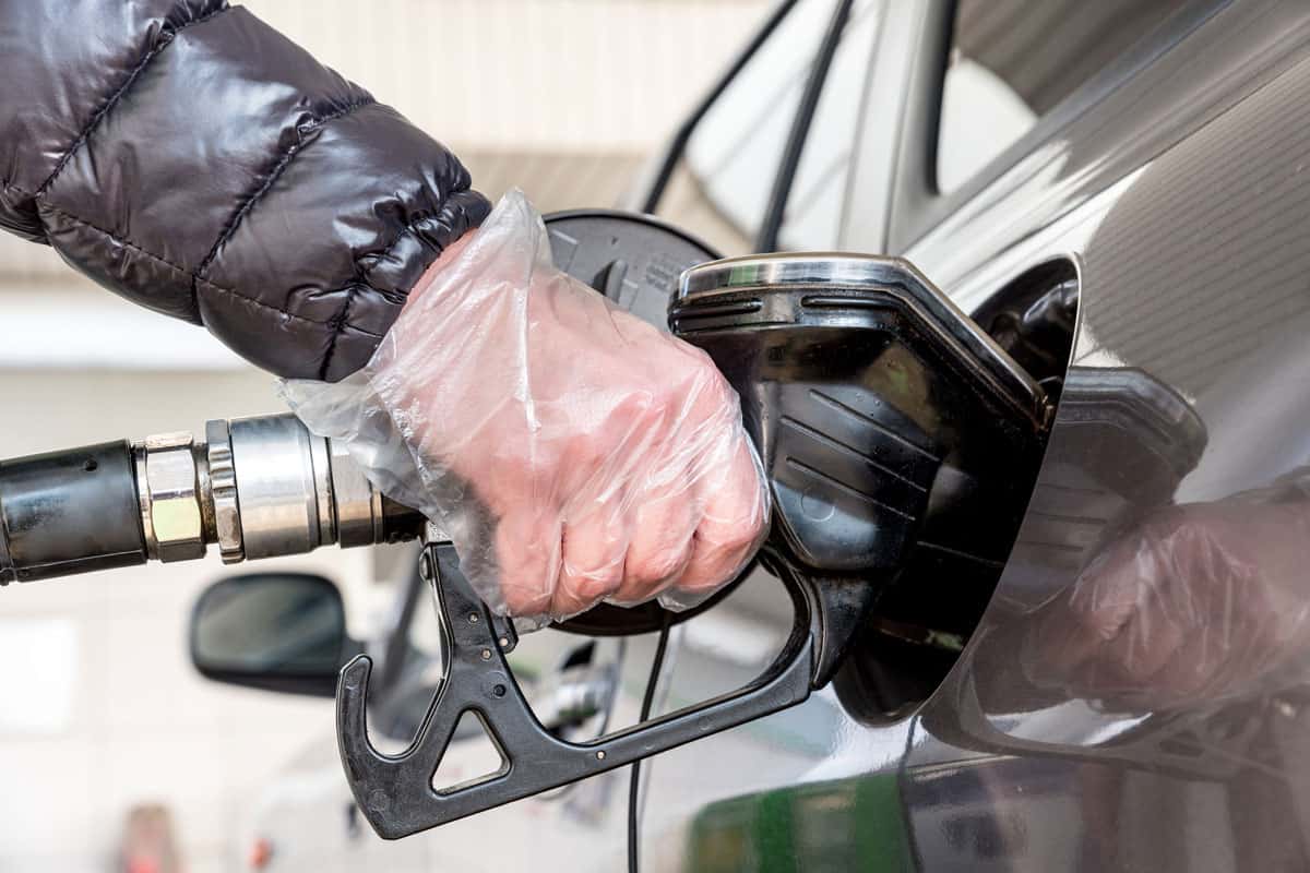 Woman Hand Refueling the Car in Filling Station