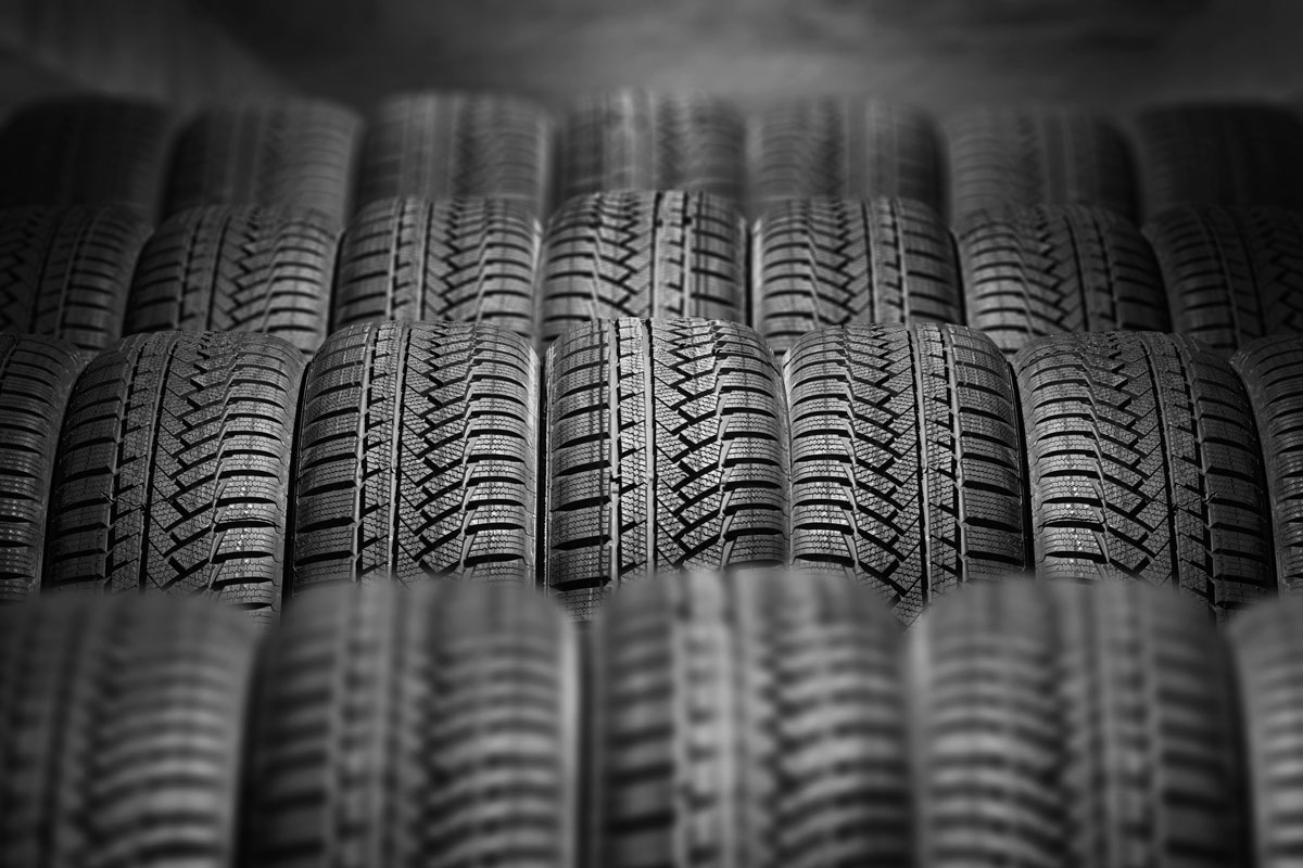 a lot of new car tires in the warehouse