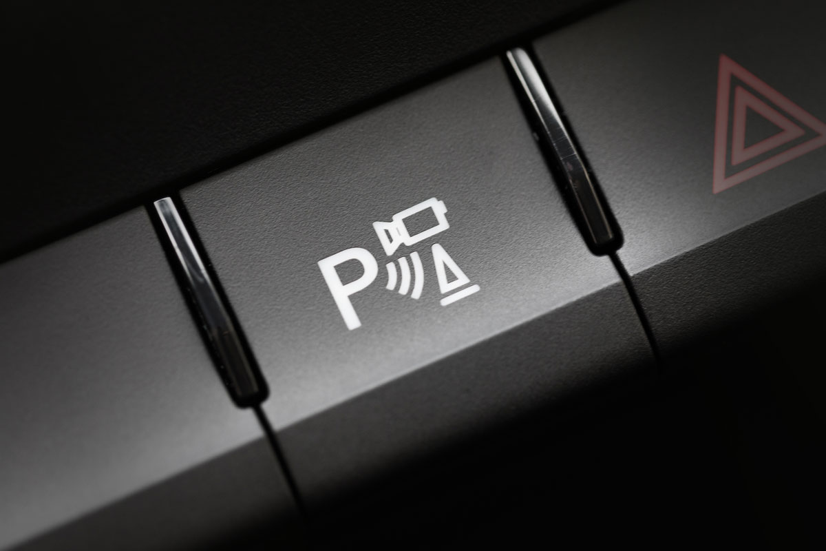 button for turning on the rear view camera in the car parking assistance