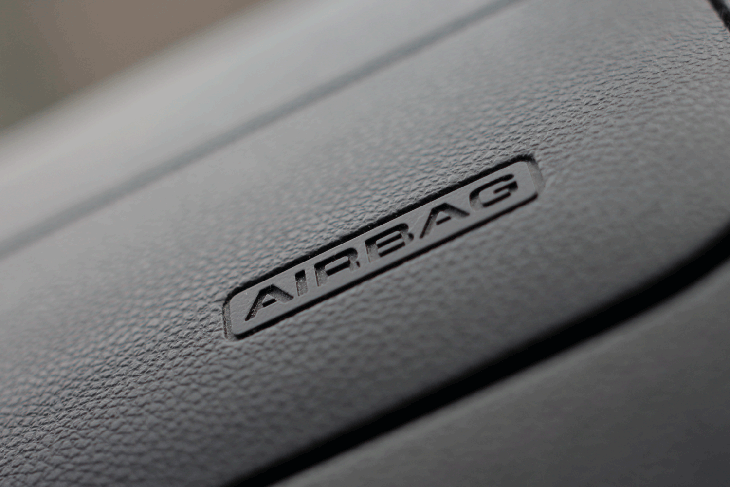 close up image of airbag compartment of a car