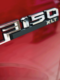 ford f150 side emblem on a red pickup truck. How To Tell What Engine Is In My Ford F150