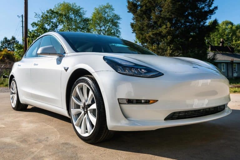 A brand new white Tesla Model 3, Does Tesla Model 3 Have Collision Avoidance?