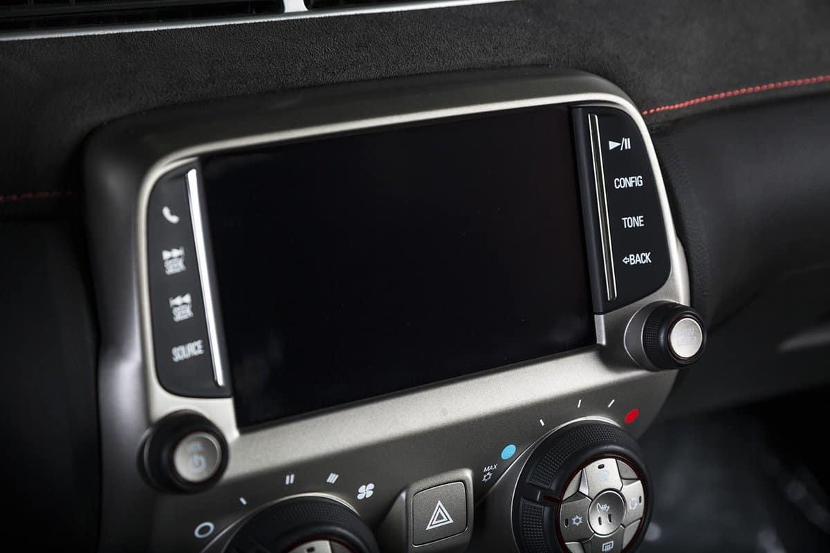 A close up shot of the infotainment system of a modern car