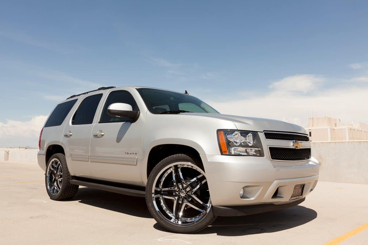  A photo of a silver Chevrolet Tahoe sport utility vehicle. The Tahoe is a very popular SUV in the United States