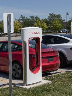 A red colored Tesla Model S at a charging station, Is Tesla Model 3 Hybrid?