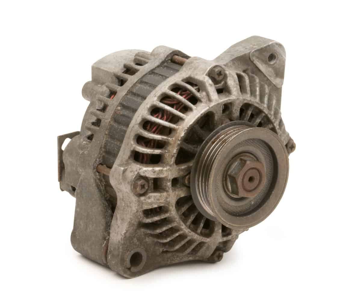 A used automotive alternator isolated on white. Clipping Path on object.