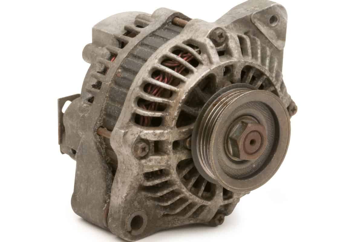 A used automotive alternator isolated on white. Clipping Path on object.
