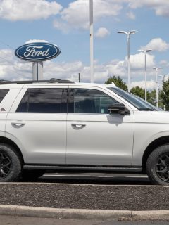 A white Ford Expedition on the parking lot, Ford Expedition Interior Lights Flashing—Why And What To Do?