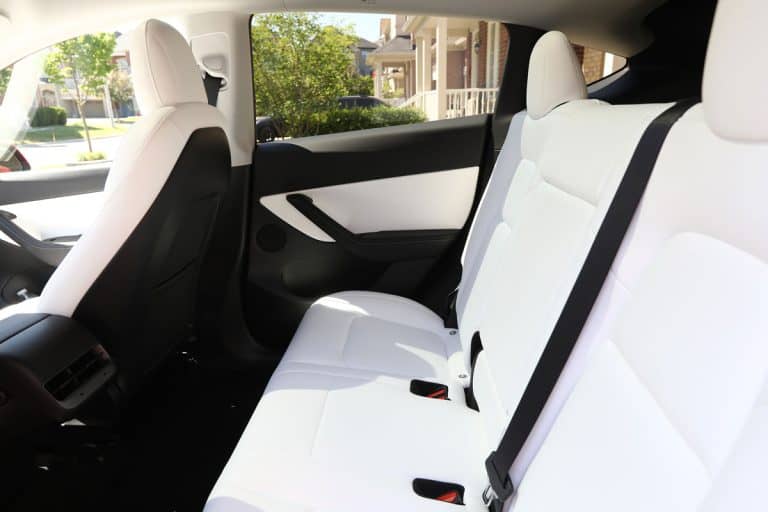 Brand new 2022 Tesla Model Y Dual Motor in red color with white and black interior. Modern electric vehicle, Does Tesla Model 3 Have Ac Seats?