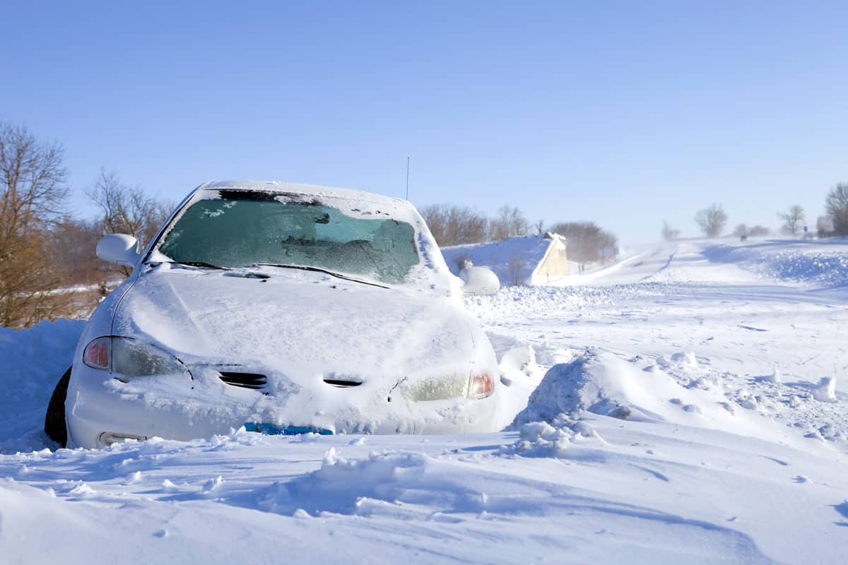 Car covered in heavy snow