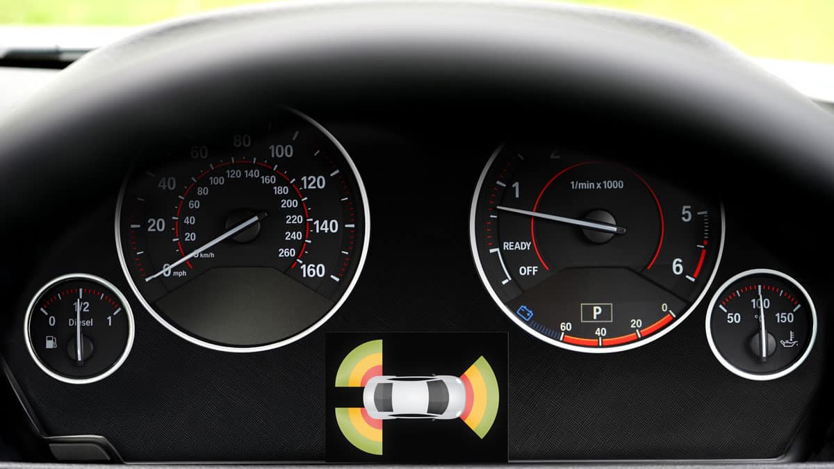 Car dashboard showing the different gauges and the 360 degree view of the car