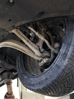 Car in a car service on a lift. Diagnosis and repair of the front suspension, Front Wheels Pointing In Different Directions - What To Do?