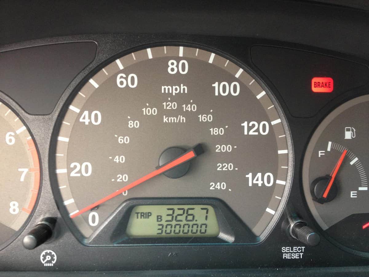 Car odometer displaying 300 thousand miles