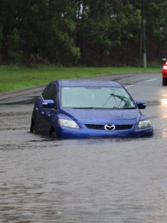 Car stuck in floodwater in the suburb of Rocklea from huge rainfall as a result of Tropical Cyclone - Car Won't Start After Driving Through Water - What To Do