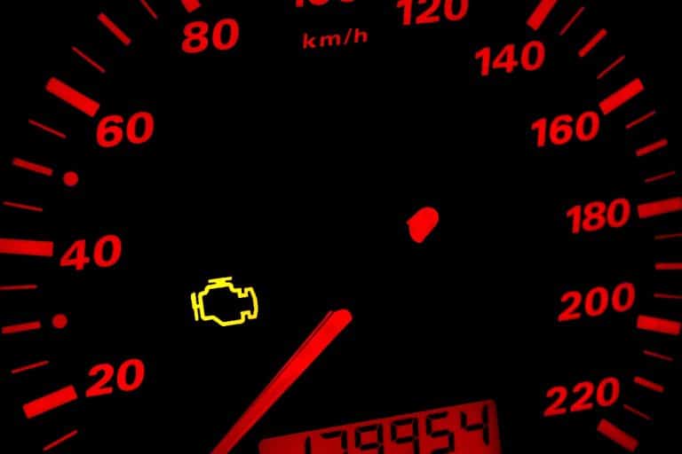Check engine light on a car dashboard, Check Engine Light Comes On When Gas Is Low - What To Do?