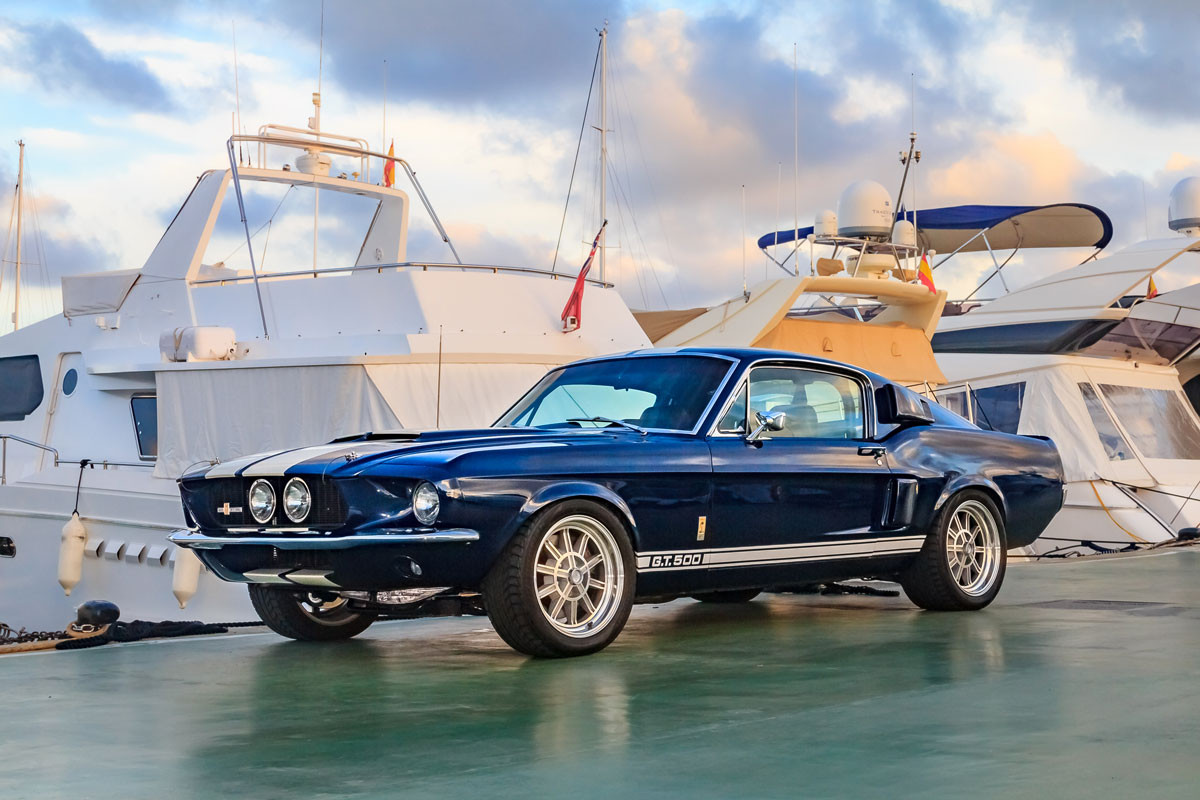 Classic rare American muscle car, vintage blue Ford Mustang Shelby Cobra GT-500 Fastback on a pier in Mallorca