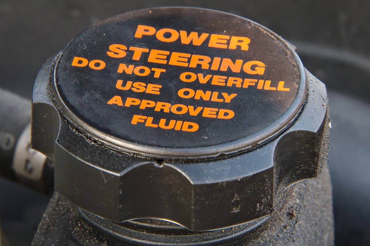 Close up of a cap of a power steering oil tank