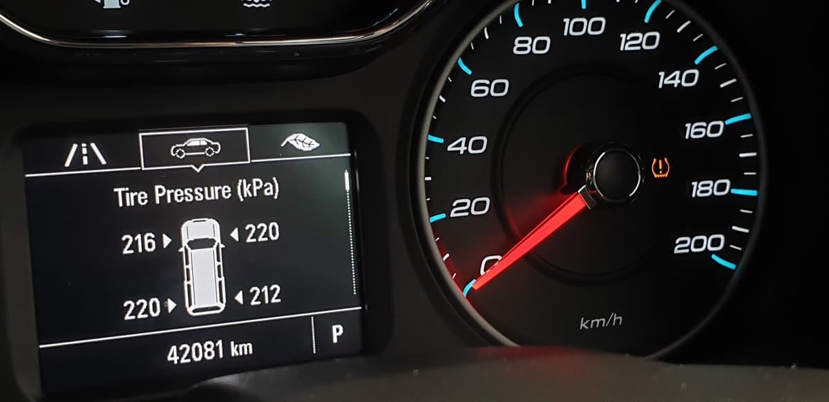 Closeup activated TPMS (Tire Pressure Monitoring System) monitoring display on vehicle cluster, Check tire pressure.