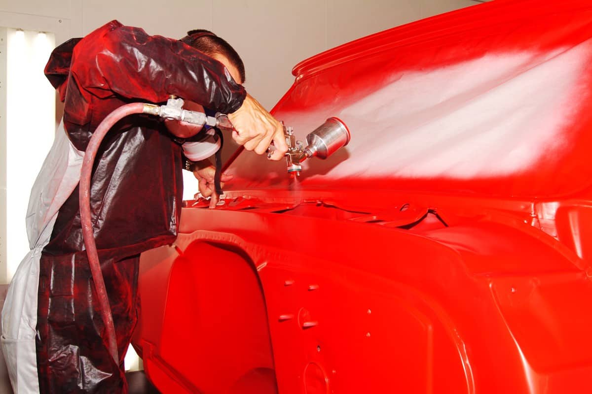 Custom Hot Rod hood gets painted a vivid red--one of several automotive paint shots in my portfolio.