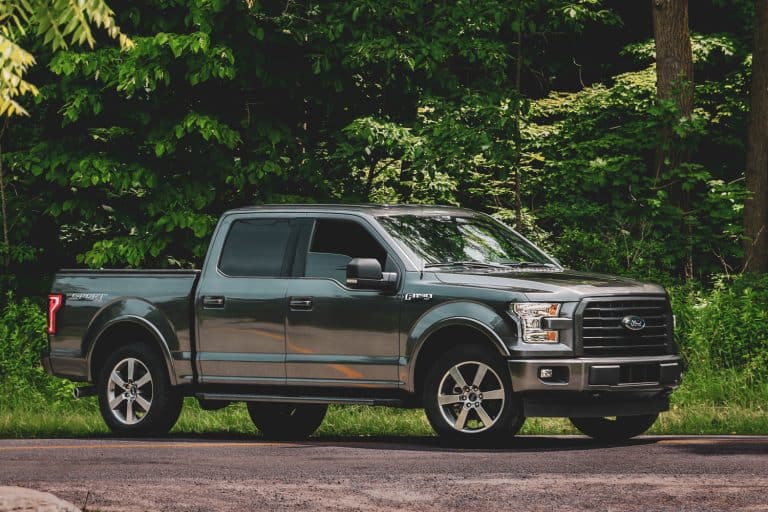 Ford F150 Truck positioned on gravel road in front of lush green foliage - Ford F-150 Gauges Flutter - What Could Be Wrong
