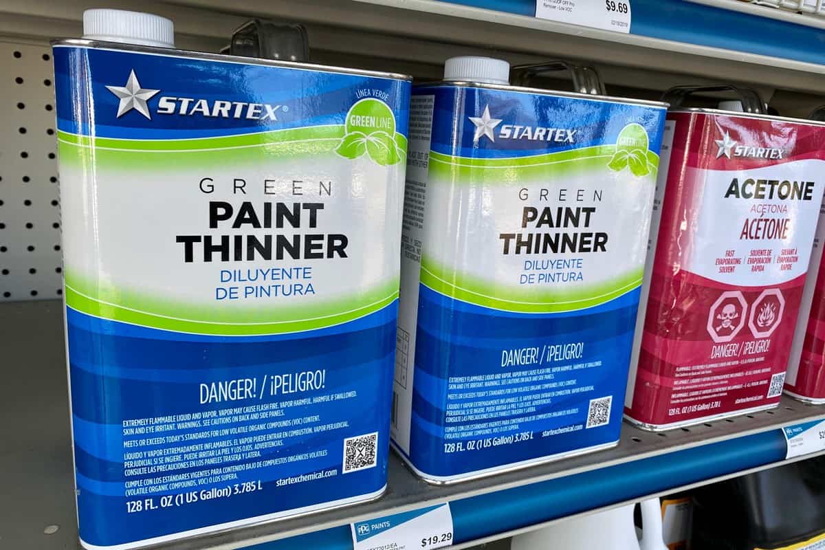 Green paint thinner cans at a store