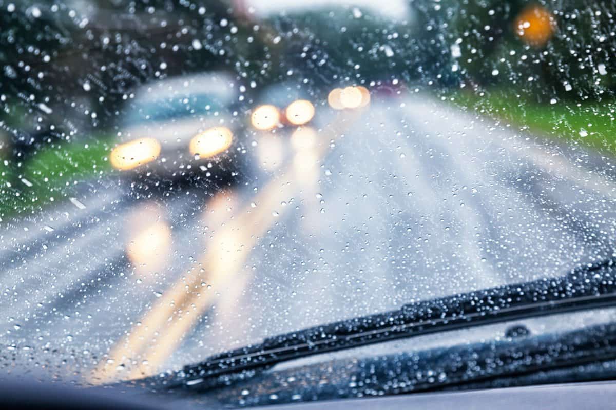 Highway Driver POV Through Raindrop Car Windshield During Rain